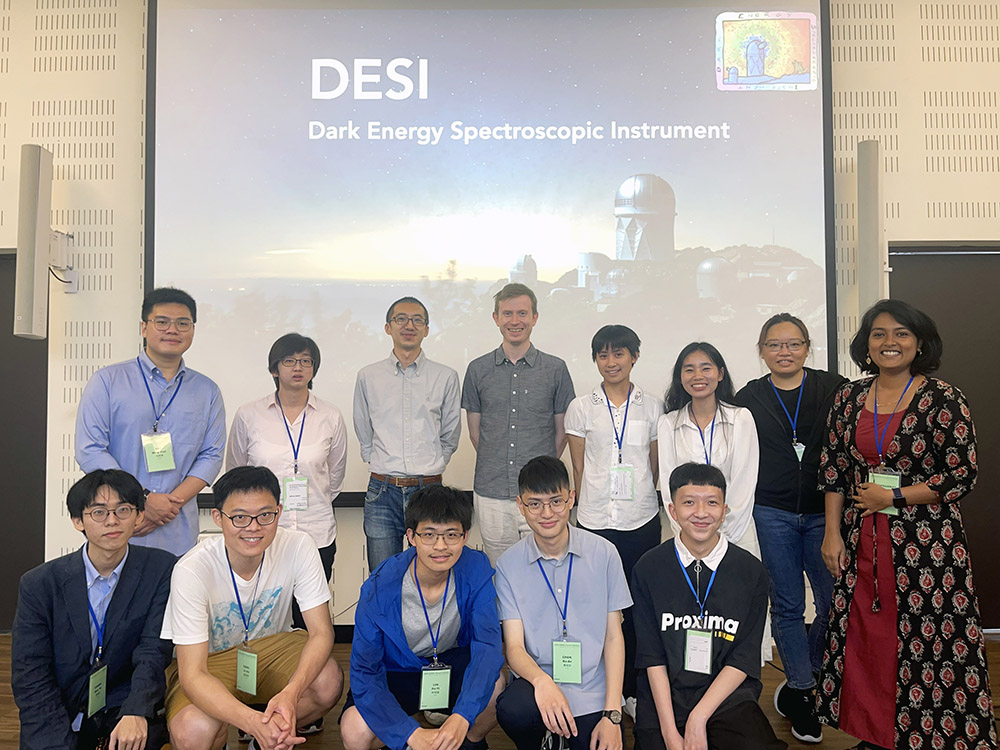Image2:Prof. Lan (third left in the back) and Prof. Cooper (fourth left in the back) along with their research team members. The background image is the Mayall Telescope, where the DESI is located. (Credit: Marilyn Sargent, UC Lawrence Berkeley National Laboratory).
